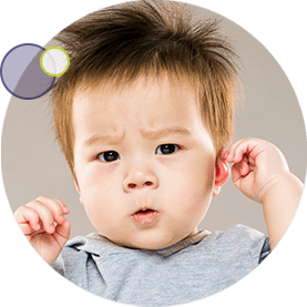 little boy holding his painful ear